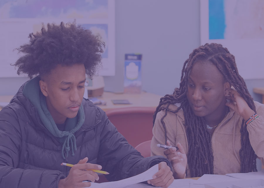 students discussing a paper